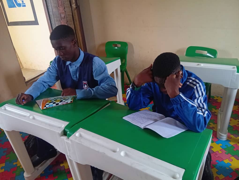 Teacher guiding pupils in class